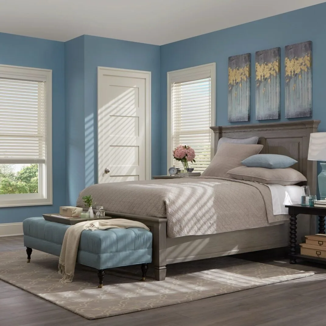 Bedroom with white Norman plantation shutters installed by Shutter King USA in Center Grove, IN