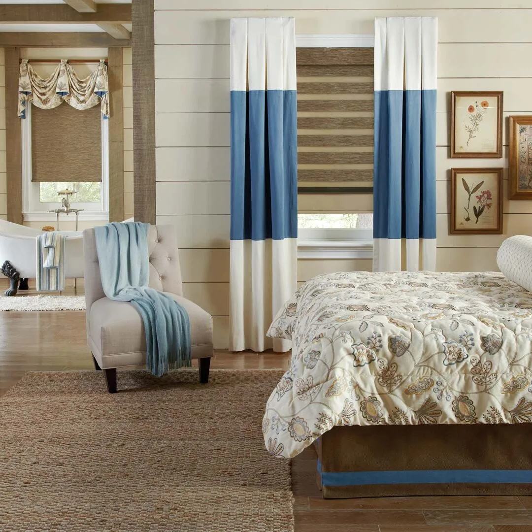 Bedroom in an Indianapolis home with custom color-block drapery and a Roman shade