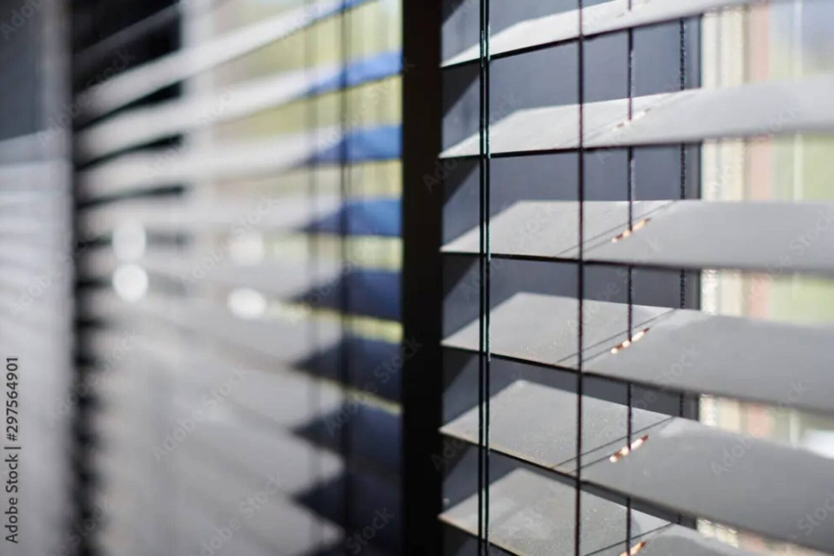 A close up of the window blinds on a building