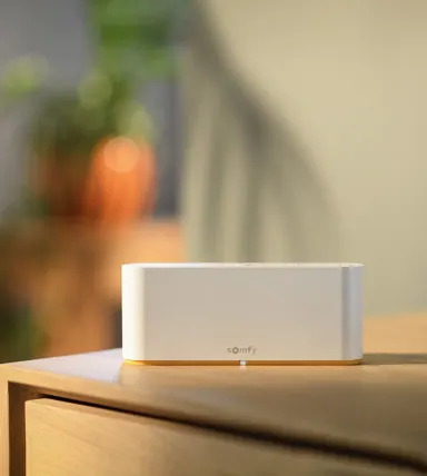 A white box sitting on top of a wooden table.